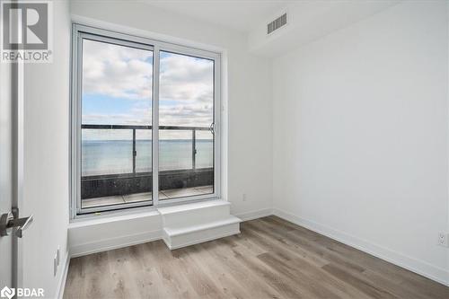 Spare room featuring a water view and light wood-type flooring - 370 Martha Street Unit# 2104, Burlington, ON - Indoor Photo Showing Other Room