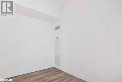 Unfurnished room with light hardwood / wood-style floors - 