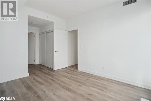 Unfurnished bedroom with light wood-type flooring and a closet - 370 Martha Street Unit# 2104, Burlington, ON - Indoor Photo Showing Other Room