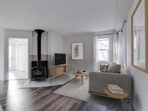 Salon - 146 Ch. Du Lac-Connelly, Saint-Hippolyte, QC - Indoor Photo Showing Living Room With Fireplace