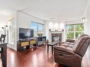 306-1201 Hillside Ave, Victoria, BC  - Indoor Photo Showing Living Room With Fireplace 