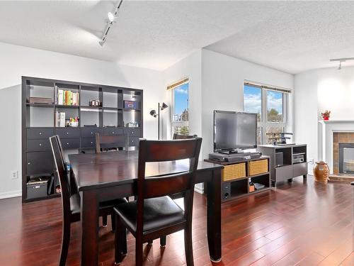 306-1201 Hillside Ave, Victoria, BC - Indoor Photo Showing Dining Room With Fireplace