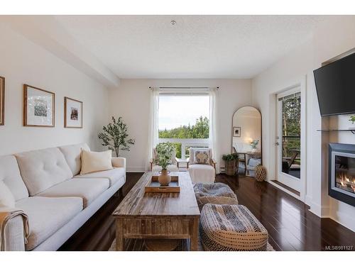 313-4529 West Saanich Rd, Saanich, BC - Indoor Photo Showing Living Room With Fireplace