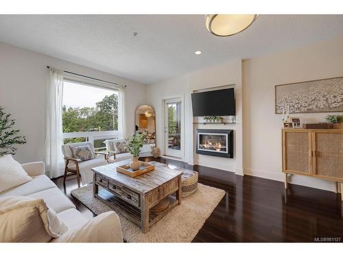 313-4529 West Saanich Rd, Saanich, BC - Indoor Photo Showing Living Room With Fireplace