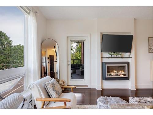 313-4529 West Saanich Rd, Saanich, BC - Indoor Photo Showing Living Room With Fireplace