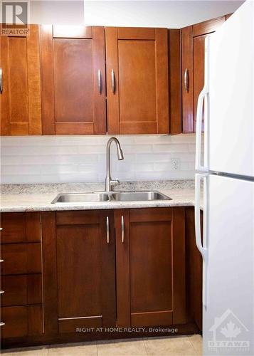 704 - 2020 Jasmine Crescent, Ottawa, ON - Indoor Photo Showing Kitchen With Double Sink