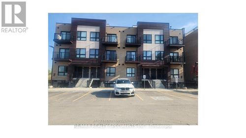 F7 - 20 Palace Street, Kitchener, ON - Outdoor With Balcony With Facade