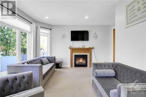 158 Lamplighters Drive, Ottawa, ON - Indoor Photo Showing Living Room With Fireplace