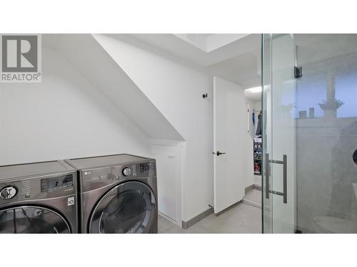 Downstairs Bathroom + Laundry - 935 Mckay Road, West Kelowna, BC - Indoor Photo Showing Laundry Room