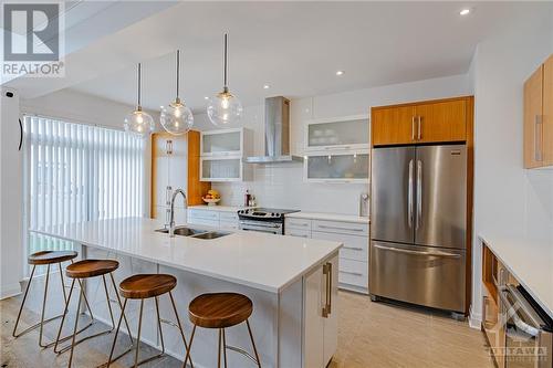 Gourmet Kitchen: A chef’s dream with quartz countertops, stainless steel appliances, extended cabinetry, and a spacious island - 734 Brian Good Avenue, Ottawa, ON - Indoor Photo Showing Kitchen With Double Sink With Upgraded Kitchen