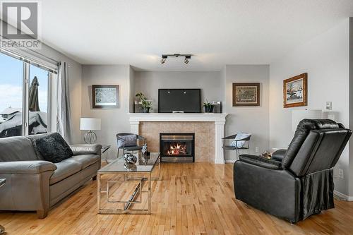 9 Royal Birch Close Nw, Calgary, AB - Indoor Photo Showing Living Room With Fireplace