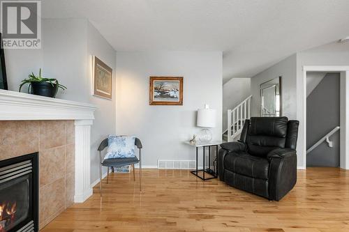 9 Royal Birch Close Nw, Calgary, AB - Indoor Photo Showing Living Room With Fireplace