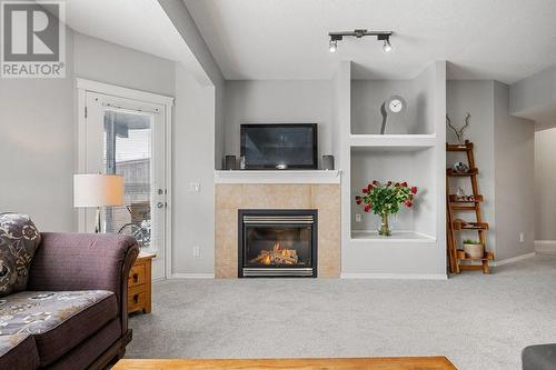 9 Royal Birch Close Nw, Calgary, AB - Indoor Photo Showing Living Room With Fireplace