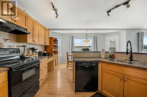 9 Royal Birch Close Nw, Calgary, AB - Indoor Photo Showing Kitchen With Double Sink