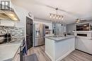 191 Saddleback Road Ne, Calgary, AB  - Indoor Photo Showing Kitchen With Stainless Steel Kitchen With Double Sink With Upgraded Kitchen 