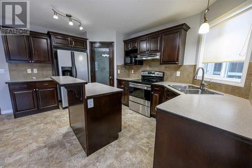 8545 102A Avenue, Grande Prairie, AB - Indoor Photo Showing Kitchen With Double Sink With Upgraded Kitchen