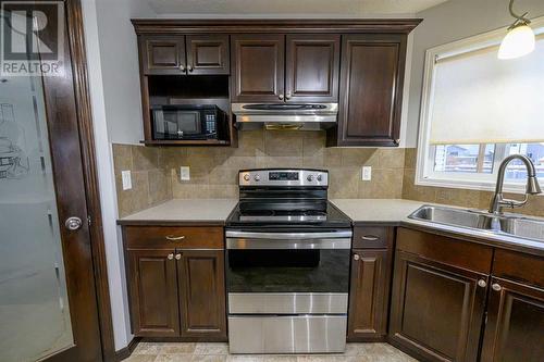 8545 102A Avenue, Grande Prairie, AB - Indoor Photo Showing Kitchen With Double Sink