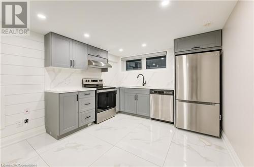 Kitchen with gray cabinets, sink, and stainless steel appliances - 1100 Union Street Unit# 3, Kitchener, ON - Indoor Photo Showing Kitchen With Stainless Steel Kitchen With Upgraded Kitchen