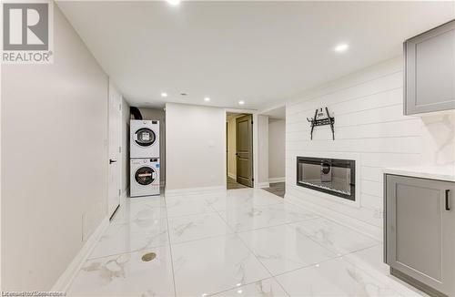 Corridor featuring stacked washer and dryer - 1100 Union Street Unit# 3, Kitchener, ON - Indoor