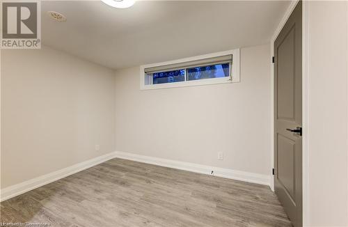 Basement with light hardwood / wood-style floors - 1100 Union Street Unit# 3, Kitchener, ON - Indoor Photo Showing Other Room