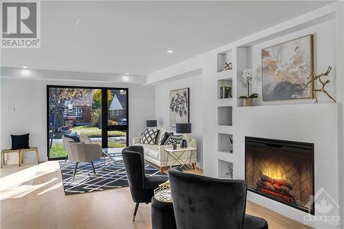 Fireplace insert is super imposed. Electric Fireplace is on order and will be installed prior to closing. - 139 Winther Avenue, Ottawa, ON - Indoor Photo Showing Living Room With Fireplace