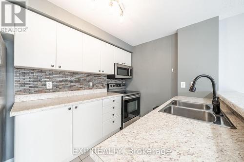 207 - 87 Aspen Springs Drive, Clarington, ON - Indoor Photo Showing Kitchen With Double Sink