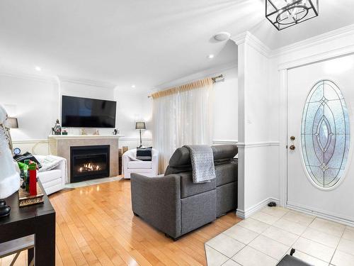 Hall - 515 Rue De La Loire, Sainte-Julie, QC - Indoor Photo Showing Living Room With Fireplace