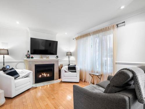 Living room - 515 Rue De La Loire, Sainte-Julie, QC - Indoor Photo Showing Living Room With Fireplace