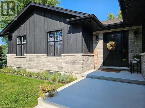 New stone, concrete driveway, windows, garage doors, board and batten - 107 Mary Avenue, Kilsyth, ON - Outdoor