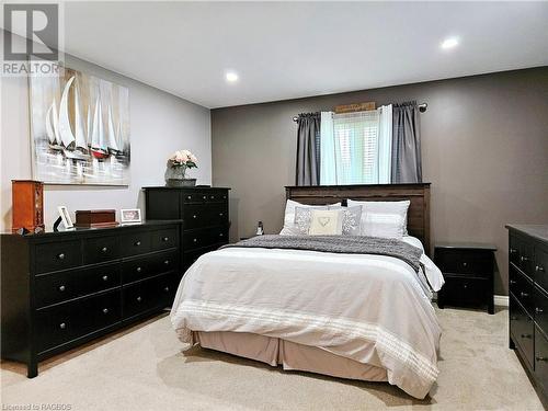 Primary bedroom with walk-in closet and three peice ensuite - 107 Mary Avenue, Kilsyth, ON - Indoor Photo Showing Bedroom