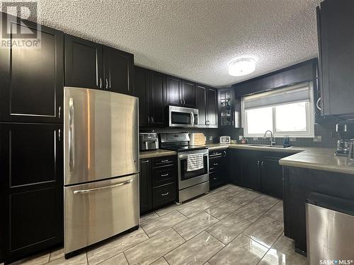 65 Jubilee Drive, Humboldt, SK - Indoor Photo Showing Kitchen With Stainless Steel Kitchen With Double Sink