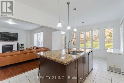 23 Covina Road, Brampton, ON - Indoor Photo Showing Kitchen With Fireplace With Double Sink