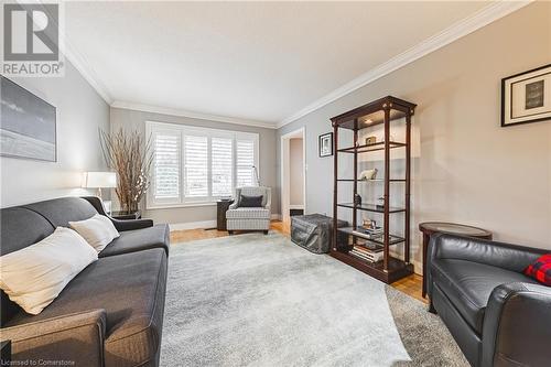 Living room with crown molding and hardwood / wood-style floors - 145 Dragoon Drive, Hamilton, ON - Indoor Photo Showing Living Room