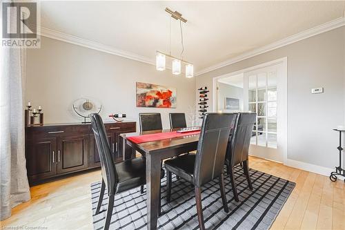 Dining room with crown molding and light hardwood / wood-style flooring - 145 Dragoon Drive, Hamilton, ON - Indoor Photo Showing Dining Room