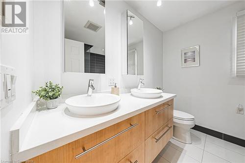 Bathroom featuring tile patterned floors, vanity, and toilet - 145 Dragoon Drive, Hamilton, ON - Indoor Photo Showing Bathroom