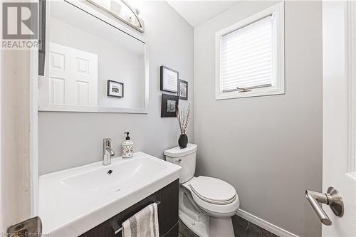 Bathroom featuring tile patterned floors, vanity, and toilet - 145 Dragoon Drive, Hamilton, ON - Indoor Photo Showing Bathroom