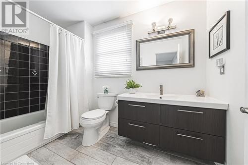 Full bathroom with vanity, toilet, and shower / bath combo with shower curtain - 145 Dragoon Drive, Hamilton, ON - Indoor Photo Showing Bathroom