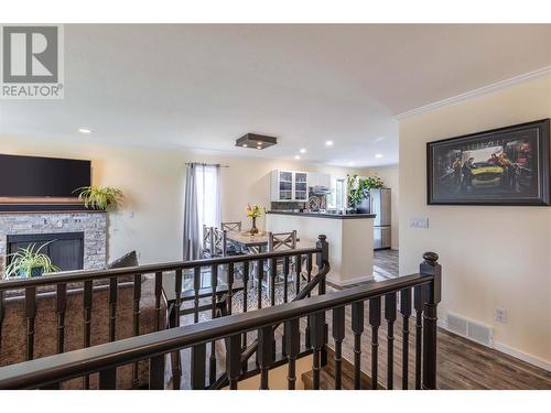 1415 Nelson Place, Kelowna, BC - Indoor Photo Showing Other Room With Fireplace