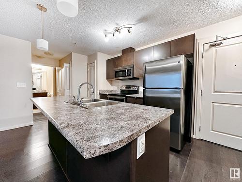 #317 3357 16A Av Nw, Edmonton, AB - Indoor Photo Showing Kitchen With Double Sink With Upgraded Kitchen