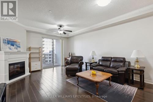 1210 - 330 Ridout Street N, London, ON - Indoor Photo Showing Living Room With Fireplace