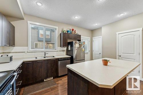 #58 6075 Schonsee Wy Nw, Edmonton, AB - Indoor Photo Showing Kitchen With Double Sink