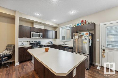 #58 6075 Schonsee Wy Nw, Edmonton, AB - Indoor Photo Showing Kitchen With Stainless Steel Kitchen With Double Sink