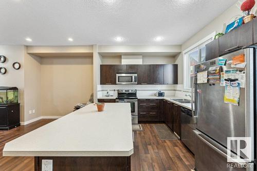 #58 6075 Schonsee Wy Nw, Edmonton, AB - Indoor Photo Showing Kitchen With Stainless Steel Kitchen With Double Sink