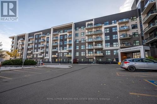 513 - 128 Grovewood Common, Oakville, ON - Outdoor With Balcony With Facade