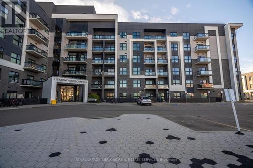 513 - 128 Grovewood Common, Oakville, ON - Outdoor With Balcony With Facade