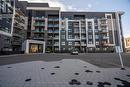 513 - 128 Grovewood Common, Oakville, ON  - Outdoor With Balcony With Facade 