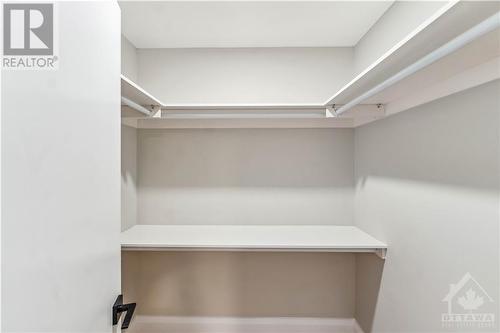 Walk-in closet in primary bedroom. - 62 Erin Crescent, Ottawa, ON - Indoor With Storage