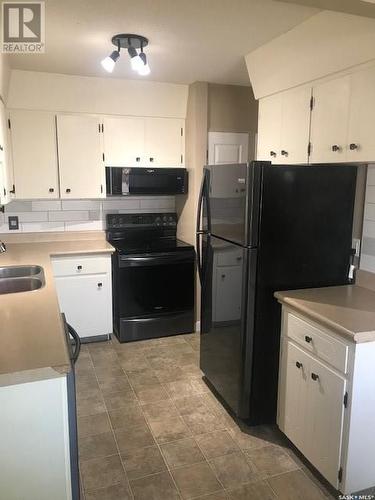 213 Mcintyre Street, Regina, SK - Indoor Photo Showing Kitchen With Double Sink