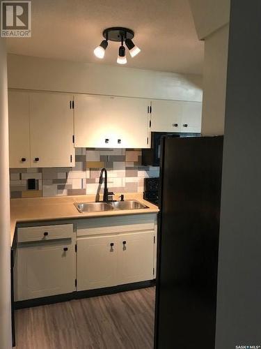 213 Mcintyre Street, Regina, SK - Indoor Photo Showing Kitchen With Double Sink