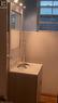 Bathroom with wood walls and vanity - 49 Robins Avenue Unit# 3, Hamilton, ON 